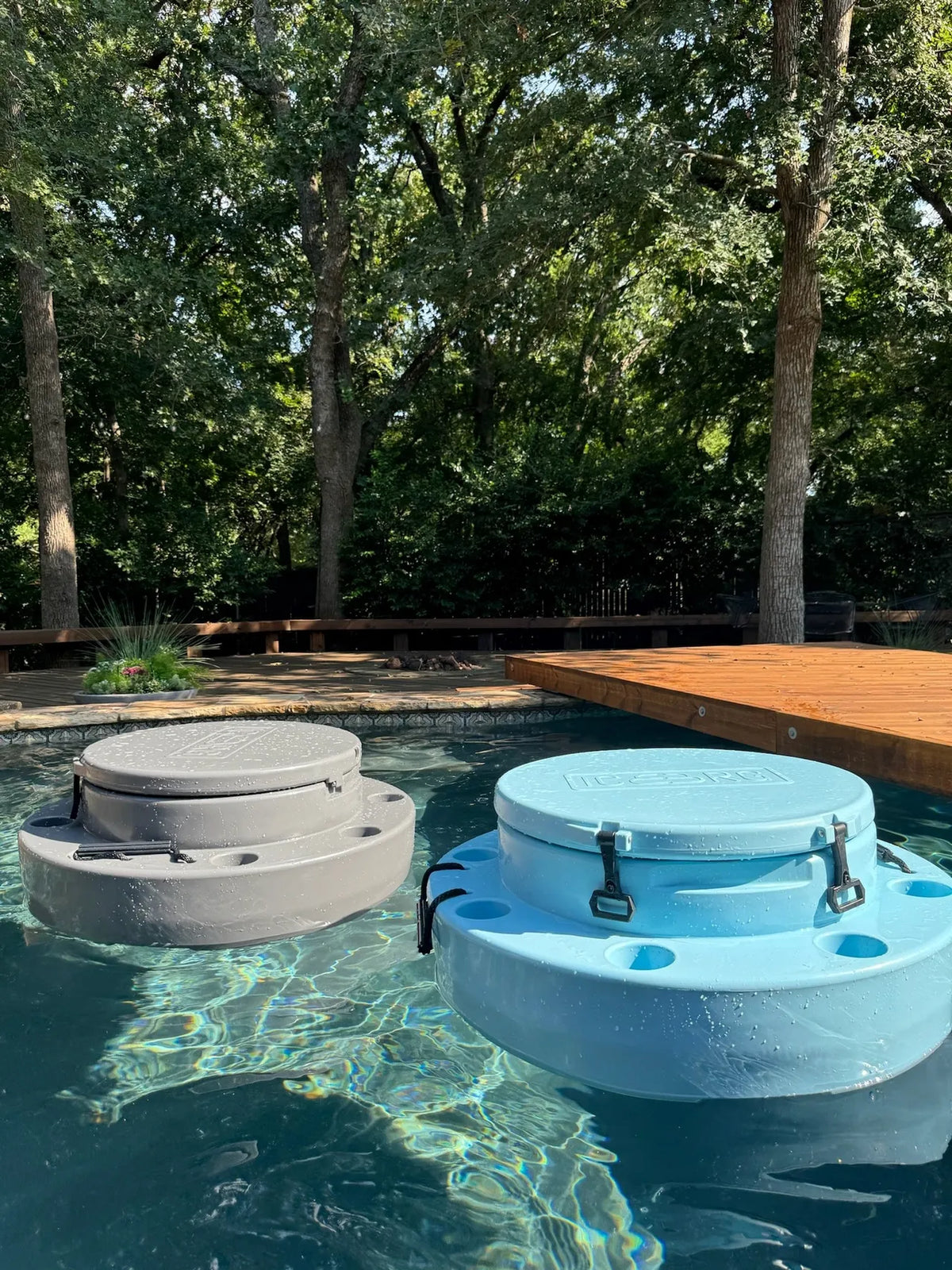 Charcoal and blue ICEBRG floating cooler in pool 